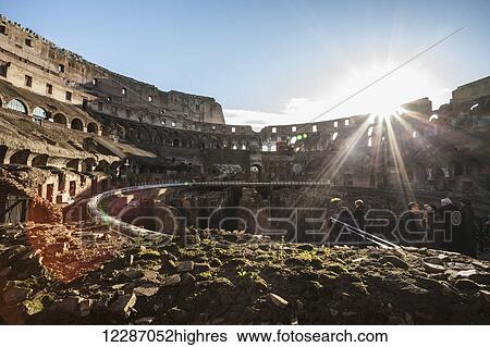 Stock Photograph - Tourists at the Colosseum; Rome, Italy. Fotosearch