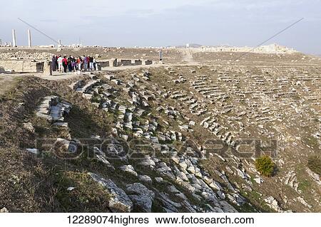 Stock Photograph - Tourists at the ruins of an amphitheatre; Laodicea, Turkey. Fotosearch
