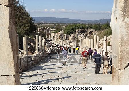 Tourists at the ruins site of Curetes Street and Hercules Gate; Ephesus, Izmir, Turkey View Large Photo Image Stock Photograph - Tourists at the ruins site of Curetes Street and Hercules Gate; Ephesus, Izmir, Turkey. Fotosearch