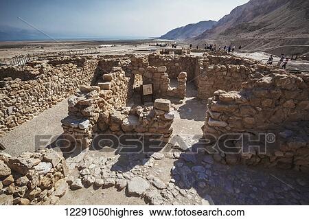 Stock Photograph - Tourists at the site of ancient ruins; Qumran, Israel. Fotosearch