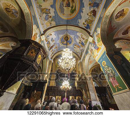 Stock Photograph - Tourists inside the colourful St. Gabriel Church; Nazareth, Israel. Fotosearch