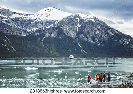 Tourists on excursion from tour boat to view Pia Glacier in Tierra del Fuego, Chilean Patagonia; Chile View Large Photo Image Stock Photograph - Tourists on excursion from tour boat to view Pia Glacier in Tierra del Fuego, Chilean Patagonia; Chile. Fotosearch