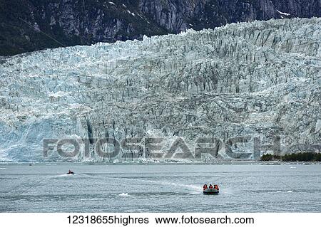 Stock Photograph - Tourists on excursion from tour boat to view Pia Glacier in Tierra del Fuego, Chilean Patagonia; Chile. Fotosearch