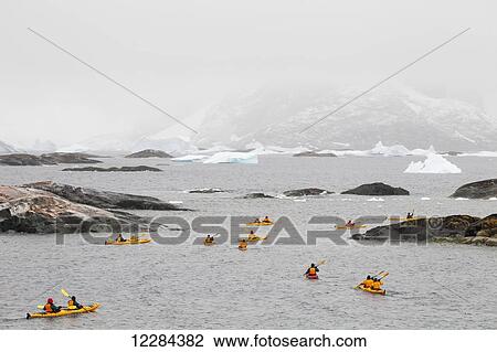 Tourists sea kayaking around Pleneau Island, Antarctic Peninsula; Antarctica View Large Photo Image Stock Image - Tourists sea kayaking around Pleneau Island, Antarctic Peninsula; Antarctica. Fotosearch