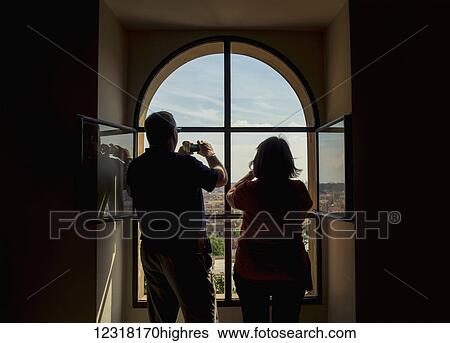 Tourists taking photographs from a window inside The Vatican; Rome, Italy View Large Photo Image Stock Photograph - Tourists taking photographs from a window inside The Vatican; Rome, Italy. Fotosearch