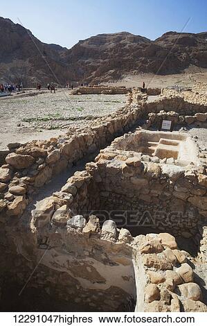 Stock Photograph - Tourists visit a site of ancient ruins; Qumran, Israel. Fotosearch