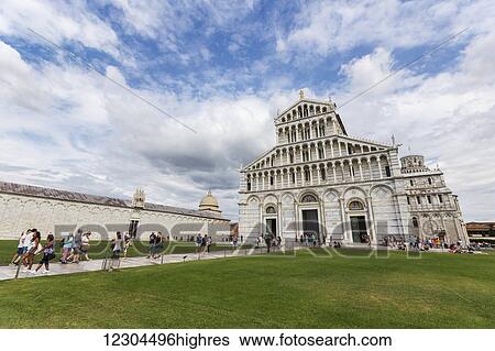 Tourists walk the grounds of the Piazza Dei Miracoli visiting the historic site and the Leaning Tower of Pisa; Pisa, Siena, Italy View Large Photo Image Stock Photograph - Tourists walk the grounds of the Piazza Dei Miracoli visiting the historic site and the Leaning Tower of Pisa; Pisa, Siena, Italy. Fotosearch