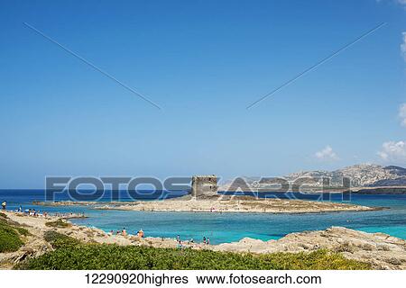 Stock Photograph - Tower of La Pelosa in La Pelosa Beach; Stintino, Sardinia, Italy. Fotosearch