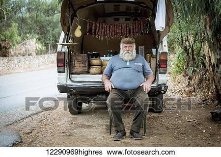 Stock Photograph - Traditional products vendor in Cala d'Ambra; San Teodoro, Sardinia, Italy. Fotosearch