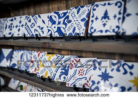 Stock Photograph - Traditional tiles on display at Vieira Pottery; Lagoa, Sao Miguel, Azores, Partugal. Fotosearch