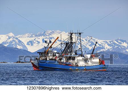Stock Photograph - Two commercial fishing boats on the waters of Main Bay near Whittier, Prince William Sound, Southcentral Alaska, USA. Fotosearch