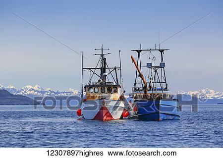 Stock Photograph - Two commercial fishing boats on the waters of Main Bay near Whittier, Prince William Sound, Southcentral Alaska, USA. Fotosearch