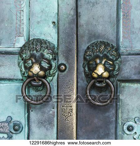 Two metal lion door knockers on double doors; Amalfi, Campania, Italy View Large Photo Image Stock Photograph - Two metal lion door knockers on double doors; Amalfi, Campania, Italy. Fotosearch