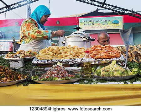 Vendors preparing food to sell; Marrakech, Morocco View Large Photo Image Stock Photograph - Vendors preparing food to sell; Marrakech, Morocco. Fotosearch