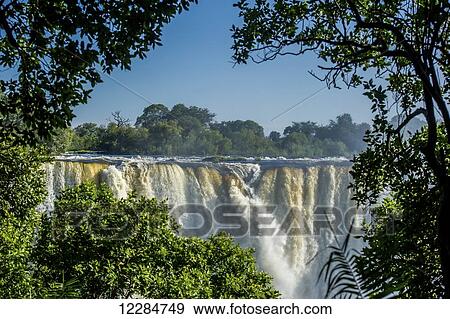 Victoria Falls waterfall; Victoria Falls, Zimbabwe View Large Photo Image Stock Photo - Victoria Falls waterfall; Victoria Falls, Zimbabwe. Fotosearch