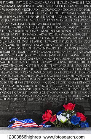 Stock Photograph - Vietnam Veterans Memorial in Constitution Gardens, adjacent to National Mall, black granite walls with 58, 272 names (as of 2012); Washington, District of Columbia, United States of America. Fotosearch