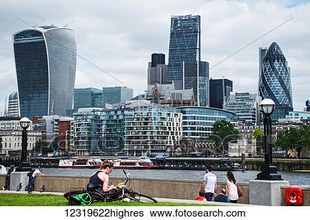 Stock Photograph - View across the River Thames to the city of London (showing the Gherkin and Walkie Talkie buildings); London, England. Fotosearch