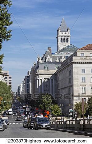 View down Twelfth Street NW toward 315-foot clock tower of the Old Post Office Pavilion from corner of Constitution Avenue, pavilion being developed as a Donald Trump hotel, tower administered by National Park Service and built in 1899; Washington,... View Large Photo Image Stock Photograph - View down Twelfth Street NW toward 315-foot clock tower of the Old Post Office Pavilion from corner of Constitution Avenue, pavilion being developed as a Donald Trump hotel, tower administered by National Park Service and built in 1899; Washington,.... Fotosearch