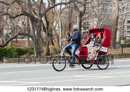 View of a bicycle taxi in Central Park; New York City, New York, United States of America View Large Photo Image Stock Photograph - View of a bicycle taxi in Central Park; New York City, New York, United States of America. Fotosearch