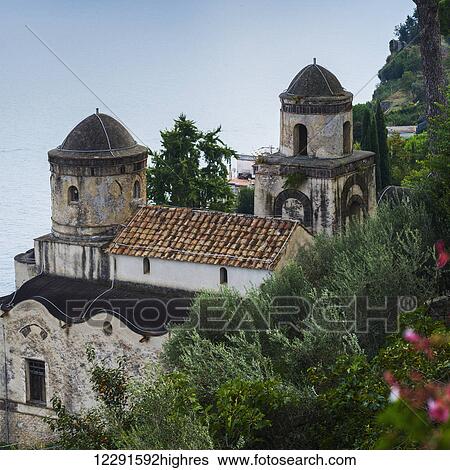 Stock Photograph - View of a building and water along the Amalfi Coast; Ravello, Italy. Fotosearch