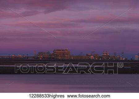 Stock Photograph - View of Flow Station 1 (FS1) at sunrise in the Prudhoe Bay Oilfield, North Slope, Arctic Alaska, Autumn. Fotosearch