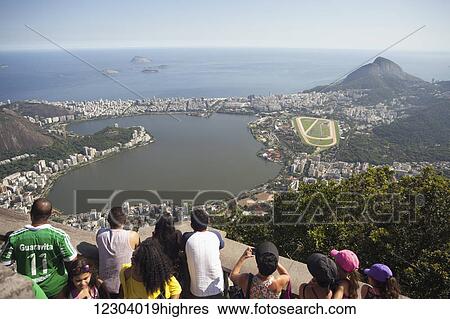 Stock Photograph - View of Jockey Club, Leblon, Ipanema and Rodrigo de Freitas Lake from Christ the Redeemer statue, Corcovado mountain, Tijaca National Park; Rio de Janeiro, Brazil. Fotosearch