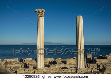 Stock Photograph - View of the Corinthian columns at the ancient city of Tharros; Tharros, Sardinia, Italy. Fotosearch