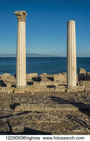 Stock Photograph - View of the Corinthian columns at the ancient city of Tharros; Tharros, Sardinia, Italy. Fotosearch