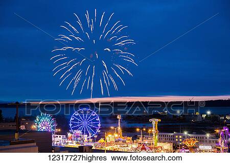 Stock Photograph - View of the Fur Rondy fireworks in downtown Anchorage, Alaska, USA, Winter.. Fotosearch
