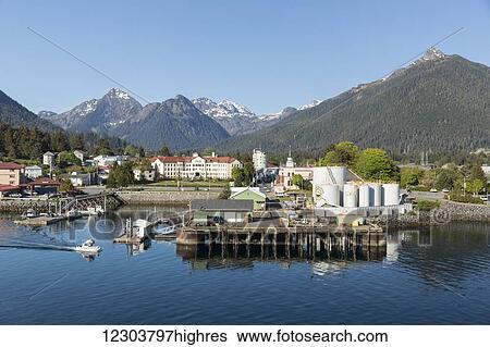 View of the pier and Sitka harbor with the Three Sisters mountains in the background, Southeast Alaska, summer View Large Photo Image Stock Photograph - View of the pier and Sitka harbor with the Three Sisters mountains in the background, Southeast Alaska, summer. Fotosearch
