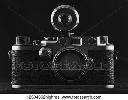 Stock Photograph - Vintage camera on a black background; Tarifa, Cadiz, Andalusia, Spain. Fotosearch