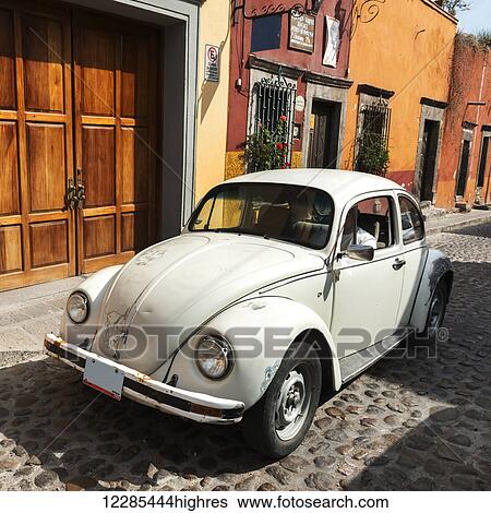 Vintage volkswagon beetle car on a cobblestone street; San Miguel de Allende, Guanajuato, Mexico View Large Photo Image Stock Photograph - Vintage volkswagon beetle car on a cobblestone street; San Miguel de Allende, Guanajuato, Mexico. Fotosearch