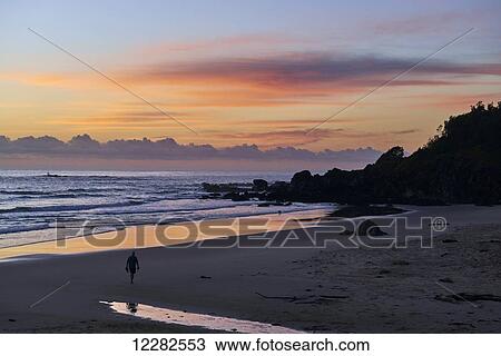 Walking on the beach at sunset; Port Macquarie, New South Wales, Australia View Large Photo Image Stock Image - Walking on the beach at sunset; Port Macquarie, New South Wales, Australia. Fotosearch