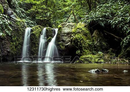Stock Photograph - Waterfall at Ribeira dos Caldeiroes; Achada, Sao Miguel, Azores, Portugal. Fotosearch