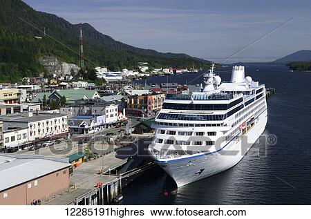Waterfront buildings and small cruise ship moored at the Ketchikan docks, Southeast Alaska, summer View Large Photo Image Stock Photograph - Waterfront buildings and small cruise ship moored at the Ketchikan docks, Southeast Alaska, summer. Fotosearch