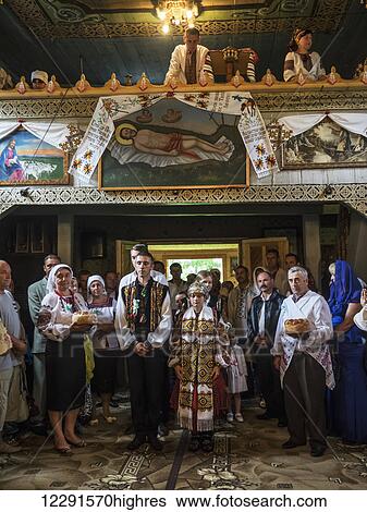 Wedding ceremony in the Orthodox Church, Hutsuls are a small mountain peoples who inhabited Carpathians, in traditional folk costumes seen only during the holidays or weddings; Kryvorivnia, Verkhovyna district, Ivano-Frankivsk region, Ukraine View Large Photo Image Stock Photograph - Wedding ceremony in the Orthodox Church, Hutsuls are a small mountain peoples who inhabited Carpathians, in traditional folk costumes seen only during the holidays or weddings; Kryvorivnia, Verkhovyna district, Ivano-Frankivsk region, Ukraine. Fotosearch