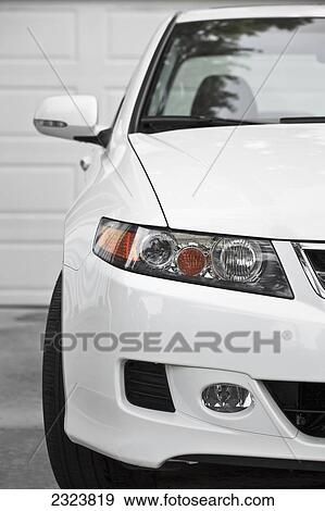 White sport sedan car, parked in driveway, close up, front view; Winnipeg, Manitoba, Canada View Large Photo Image Stock Photo - White sport sedan car, parked in driveway, close up, front view; Winnipeg, Manitoba, Canada. Fotosearch