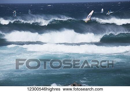 Wind surfers and sail boarders at Ho'okipa Beach, on the road to Hana; Paia, Maui, Hawaii, United States of America View Large Photo Image Stock Photograph - Wind surfers and sail boarders at Ho'okipa Beach, on the road to Hana; Paia, Maui, Hawaii, United States of America. Fotosearch