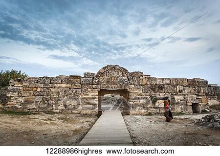 Woman walking towards the South gate, Hierapolis; Pamukkale, Turkey View Large Photo Image Stock Photograph - Woman walking towards the South gate, Hierapolis; Pamukkale, Turkey. Fotosearch