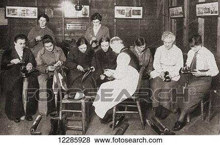 Stock Photo - Women took over many men's jobs during World War One, thereby leaving the men free to fight. Seen here a class of women receive a lesson in boot repairing from a cobbler. From The Pageant of the Century, published 1934. Fotosearch