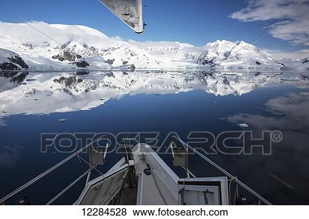 Stock Photo - Yacht in Paradise Harbour, Antarctic Peninsula; Antarctica. Fotosearch