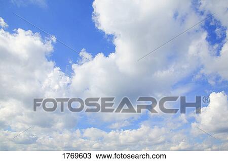 Clouds in a blue sky View Large Photo Image Stock Image - Clouds in a blue sky. Fotosearch