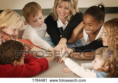 Stock Image - A group of children with teacher. Fotosearch