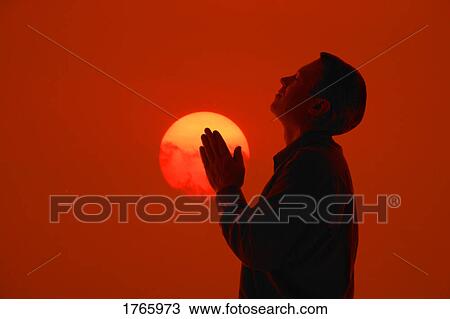 Stock Image - A man in prayer. Fotosearch