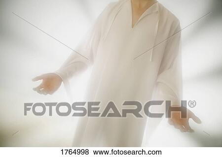 Stock Photo - An angel holds out hands. Fotosearch
