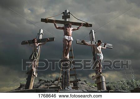 Stock Photograph - Jesus on the cross with two others. Fotosearch