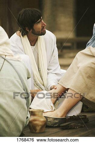 Jesus washes a disciple's feet View Large Photo Image Stock Photograph - Jesus washes a disciple's feet. Fotosearch