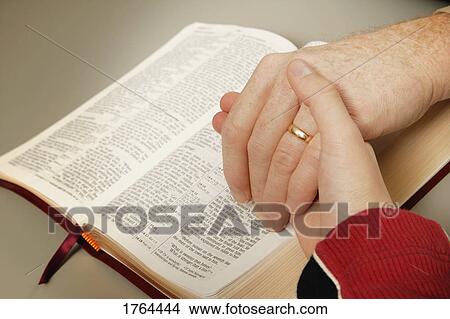 Picture - Praying the promises of God. Fotosearch