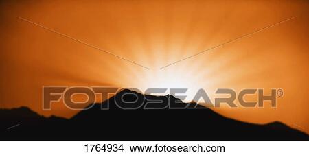Sunrise/sunset and a mountain horizon View Large Photo Image Picture - Sunrise/sunset and a mountain horizon. Fotosearch