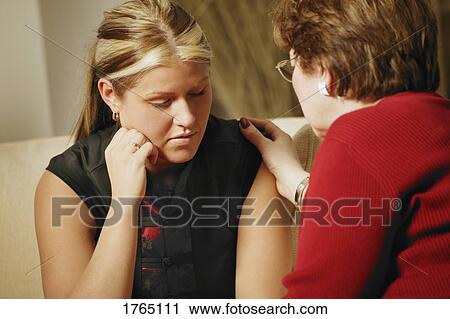 Stock Image - Woman is comforted. Fotosearch